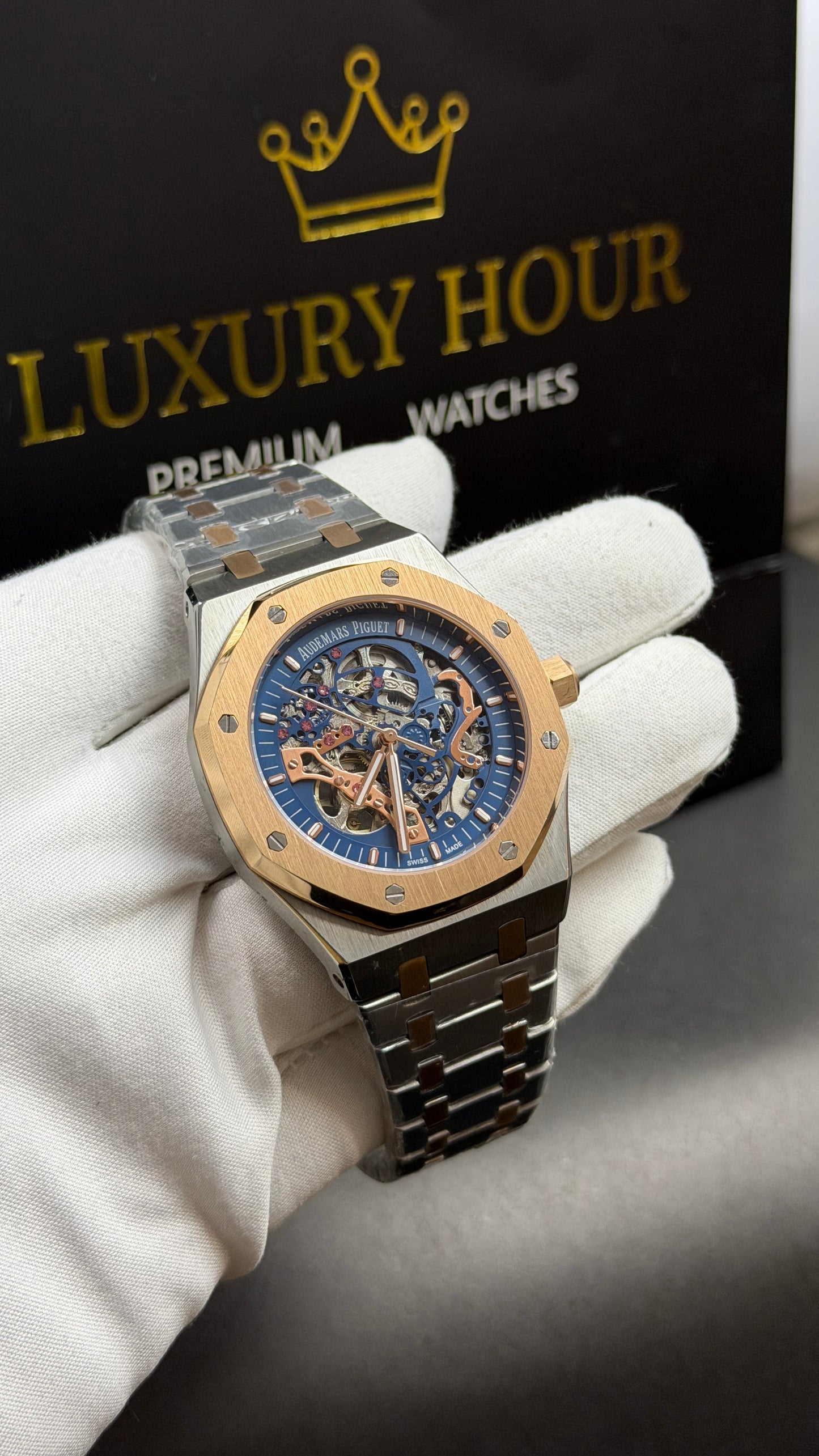 Rose Gold Two Tone with Blue Skeleton Dial.