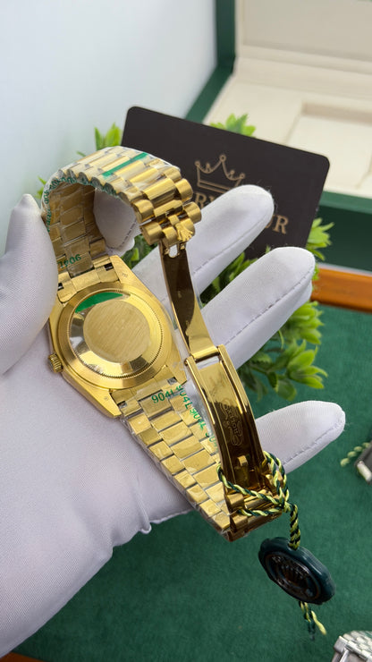 Yellow Gold with Green Marble Dial.