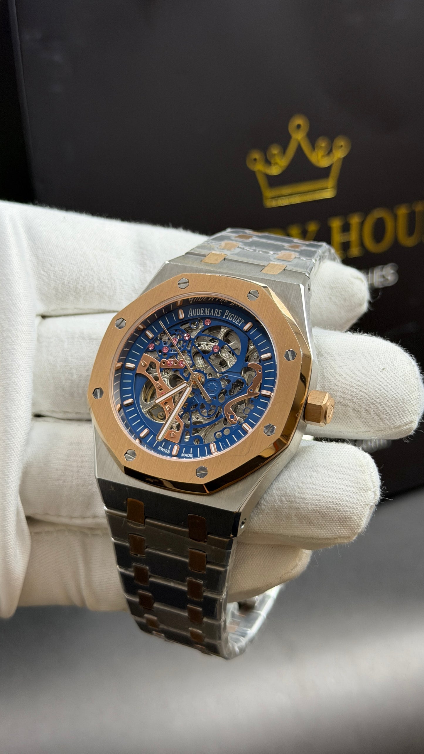 Rose Gold Two Tone with Blue Skeleton Dial.