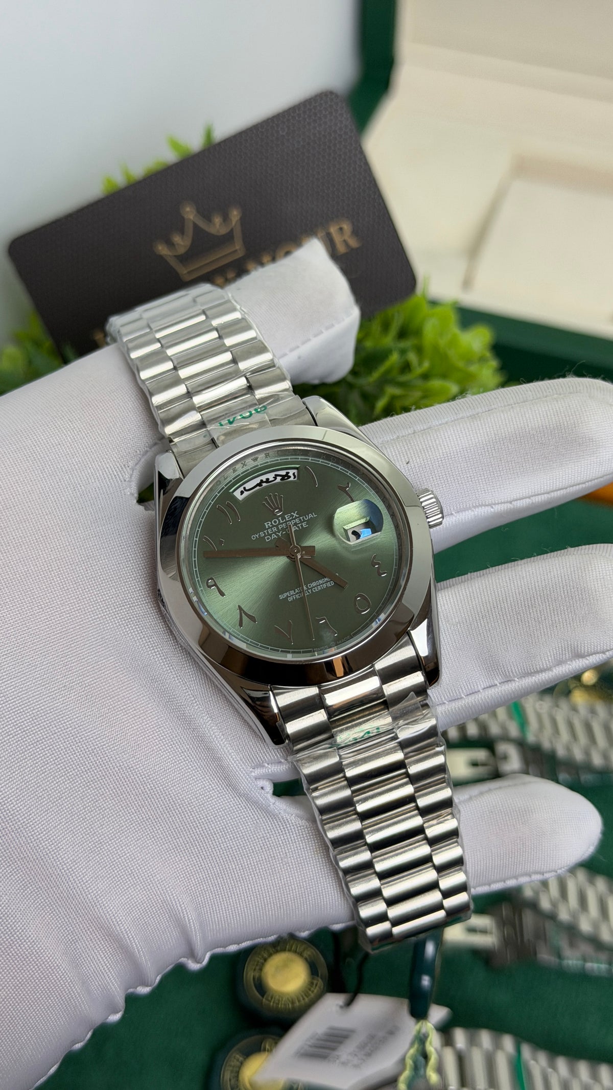 Silver with Green Dial.