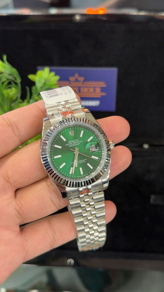 Silver with green dial