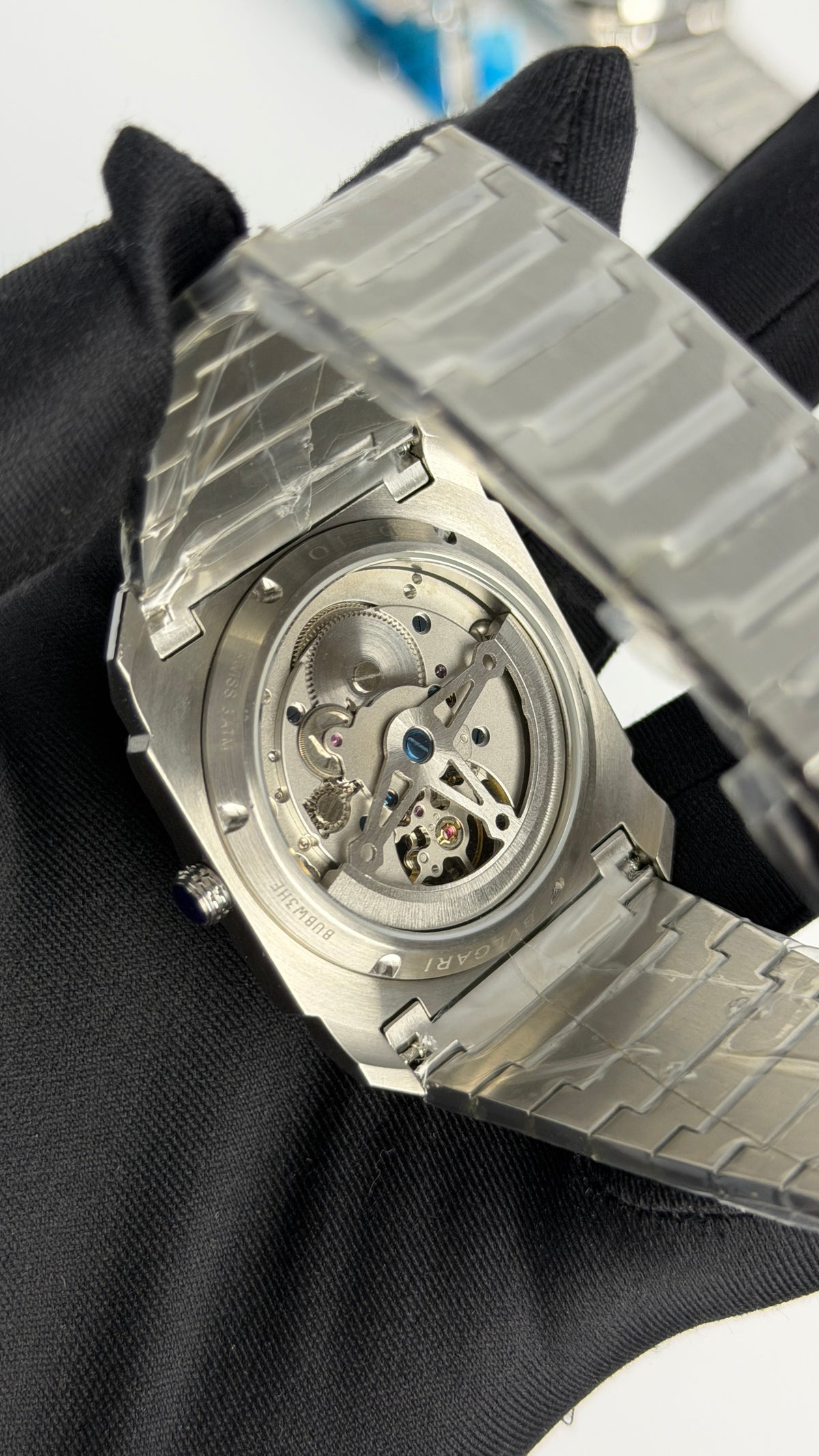 Silver with Aqua Dial.