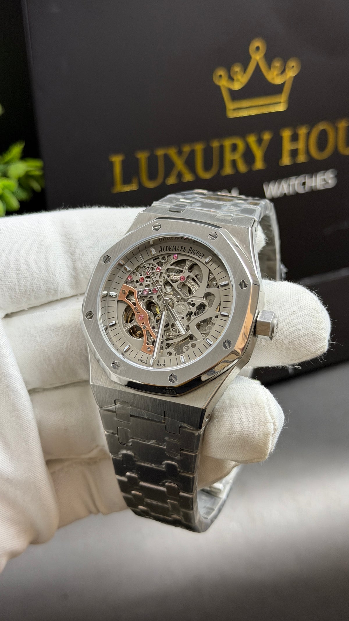 Silver with White Skeleton Dial.