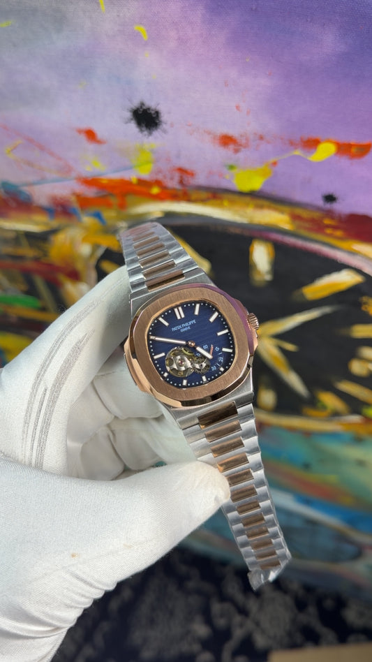 Rose gold two tone with blue dial