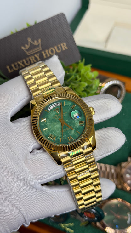Yellow Gold with Green Marble Dial.