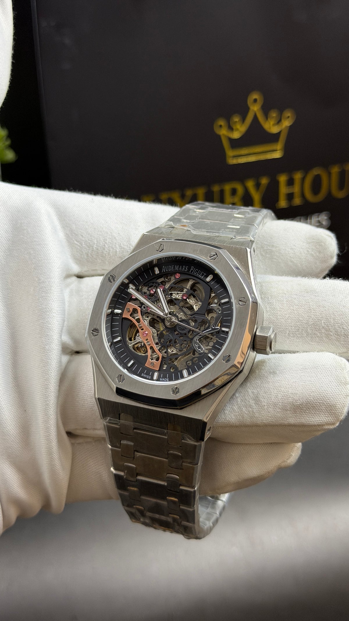 Silver with Black Skeleton Dial.