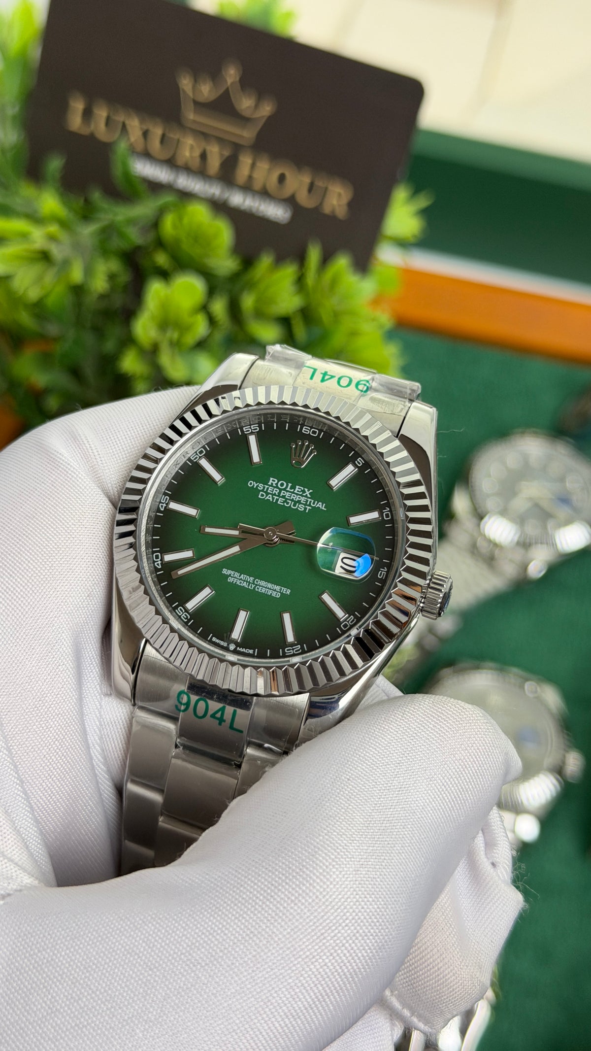 Silver with Green Dial.