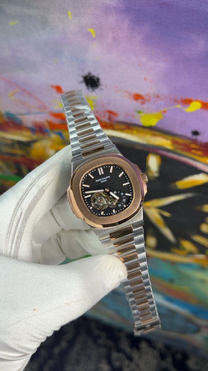 Rose gold two tone with black dial