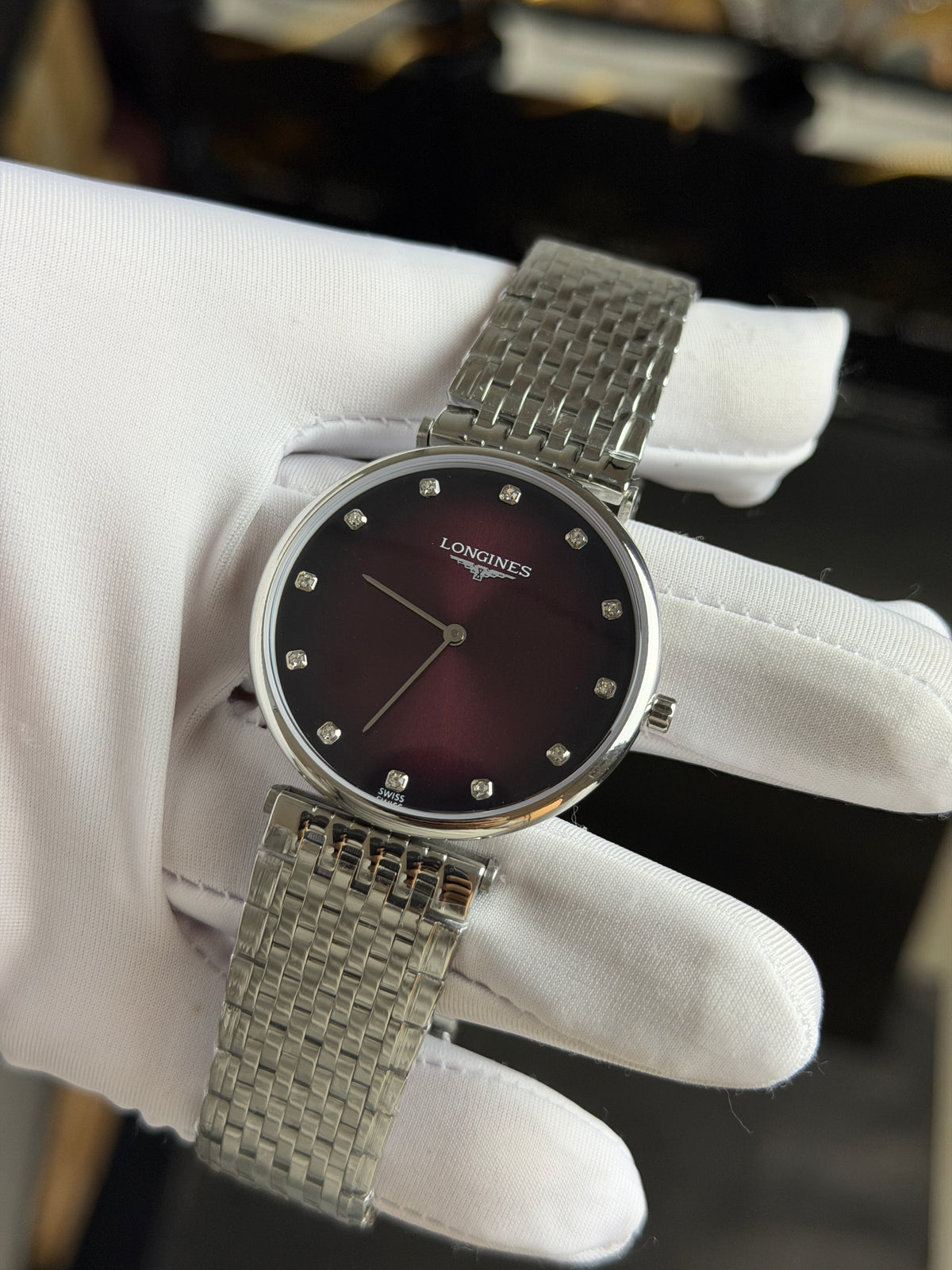 Silver with Maroon Dial.
