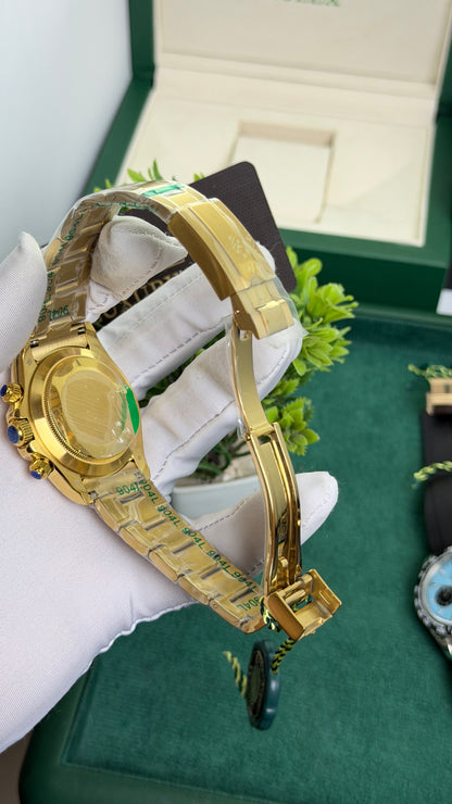 Yellow Gold with Green Dial.