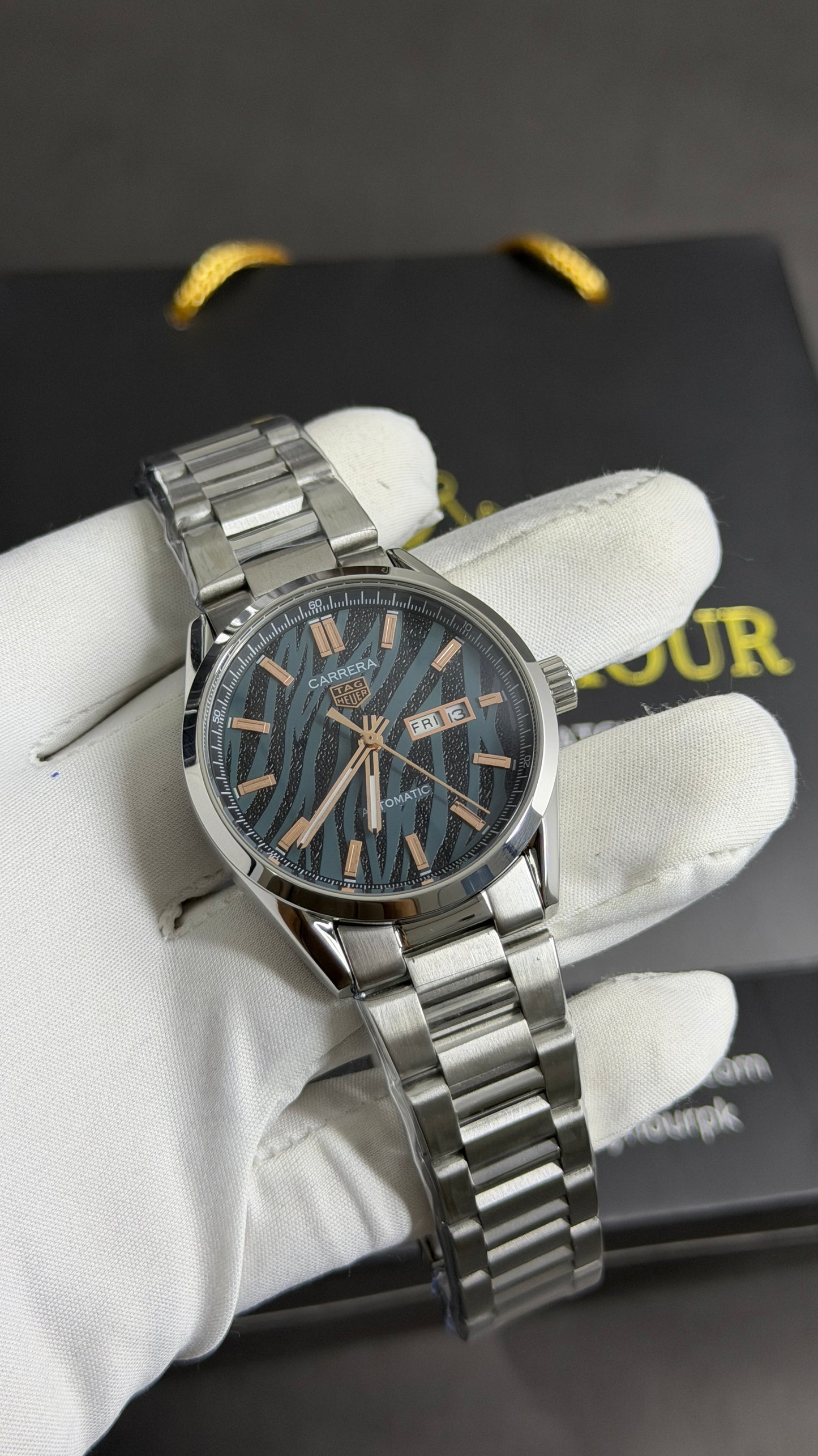 Silver with Tiger Dial.