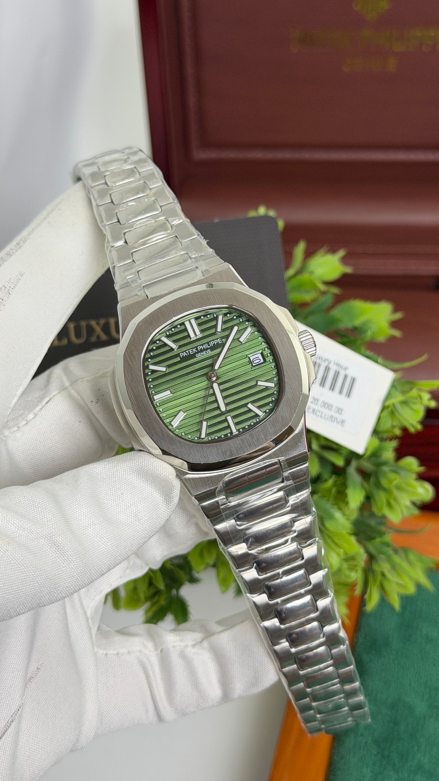 Silver with Green Dial.