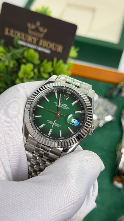 Silver with Green Dial.
