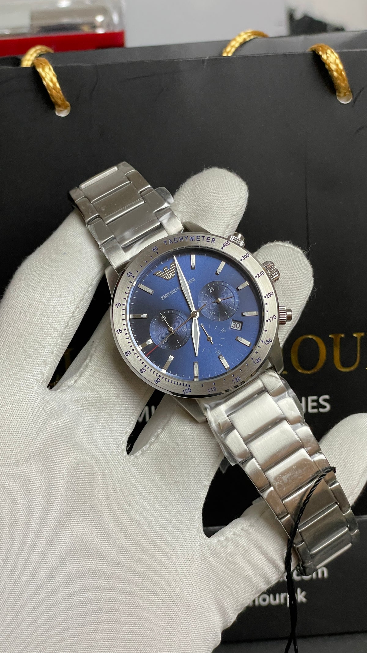 Silver with Blue Dial.