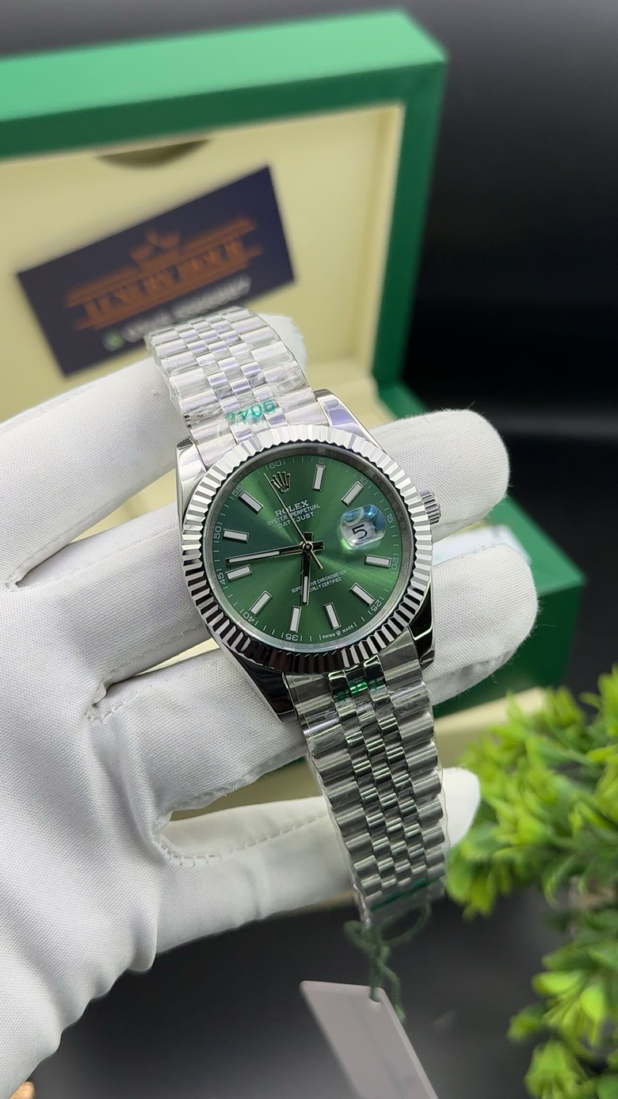 Silver with green dial