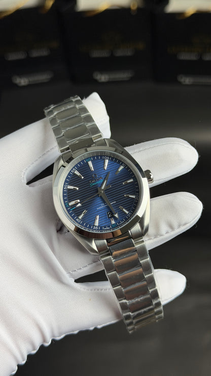 Silver with Aqua Dial.