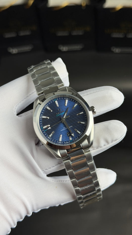 Silver with Aqua Dial.