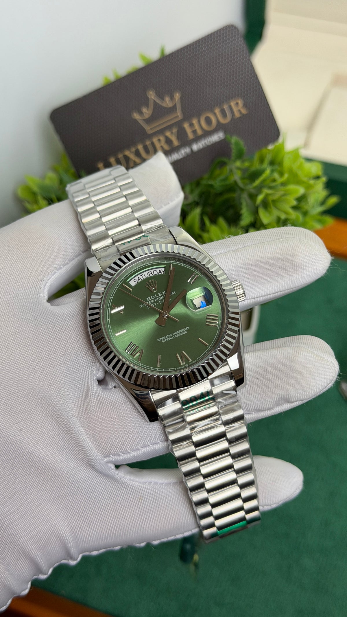Silver with Green Dial.
