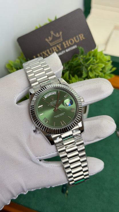 Silver with Green Dial.