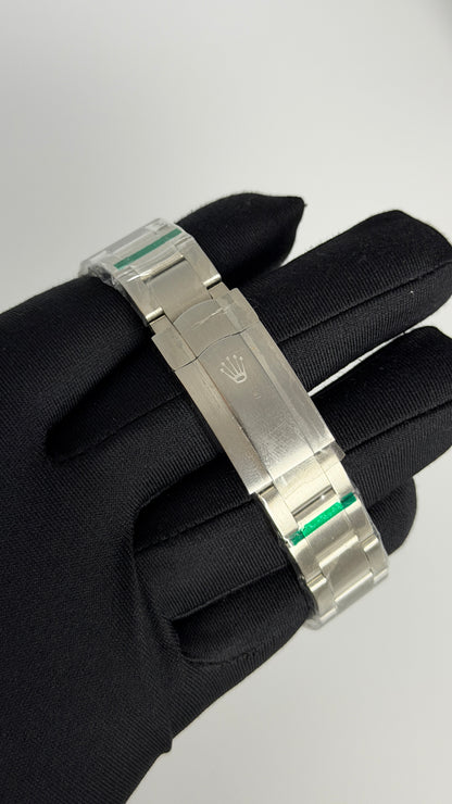 Silver with Green Dial.