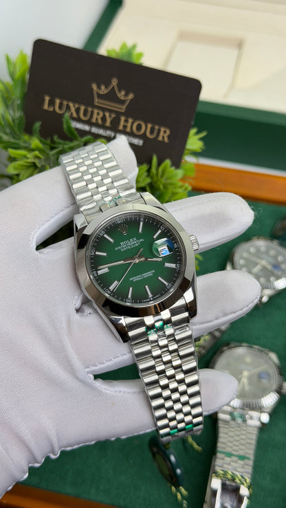 Silver with Green Dial.