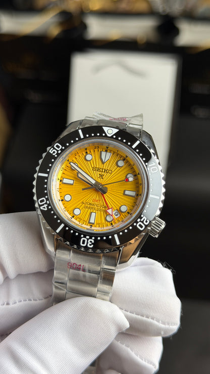 Silver with Yellow Dial.