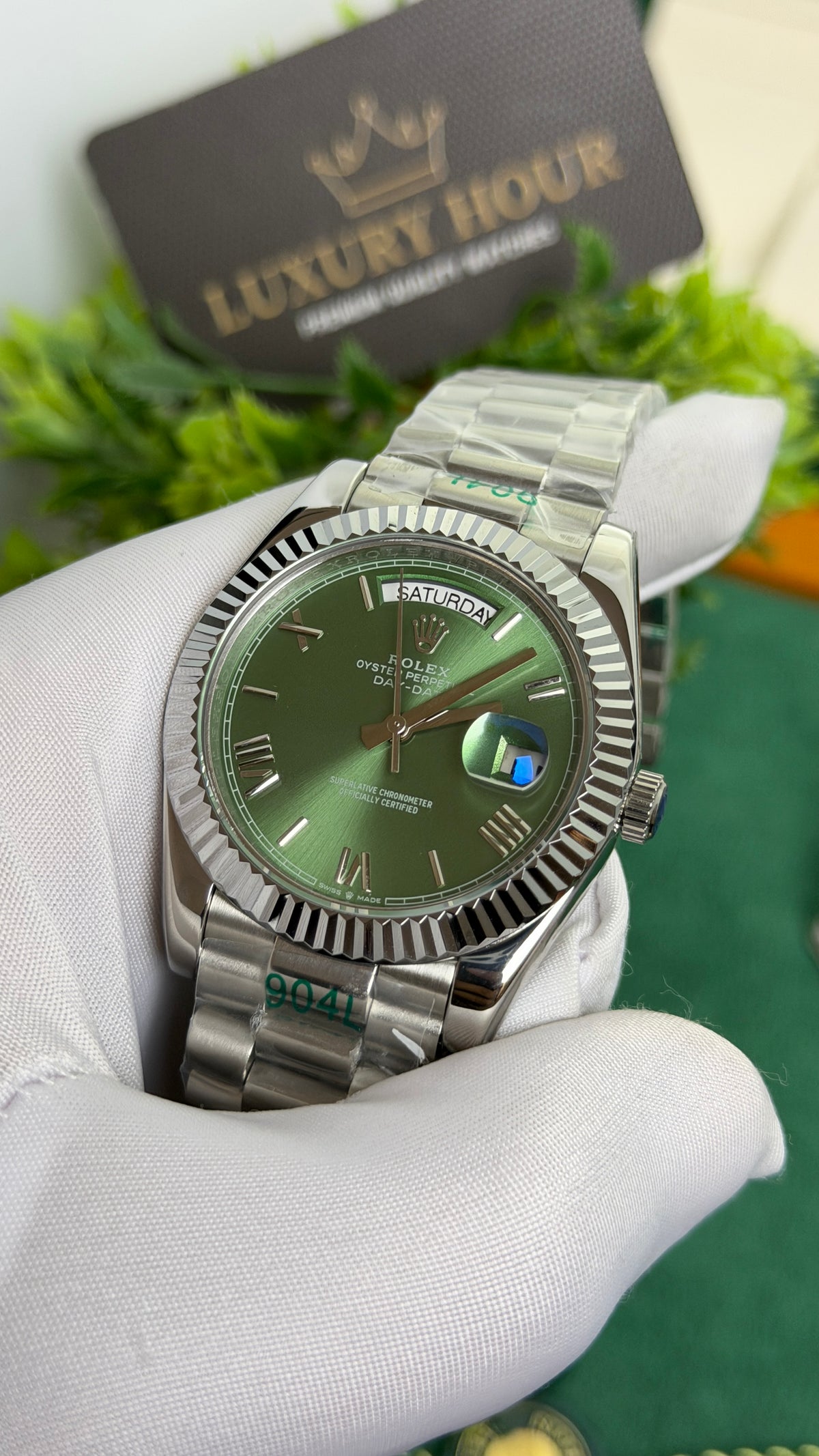 Silver with Green Dial.
