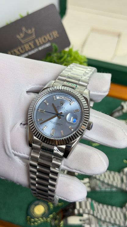 Silver with Blue Dial.