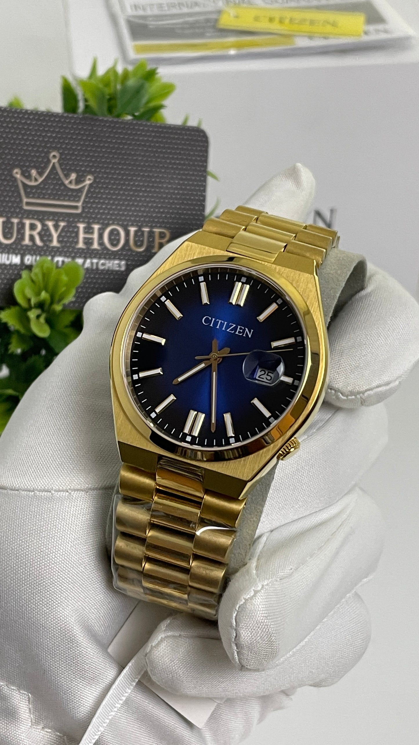 Yellow Gold with Aqua Dial.