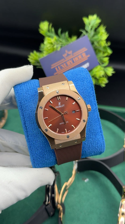 Rose gold with burgundy dial