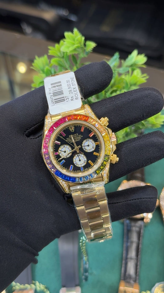 Yellow gold with rainbow stones.