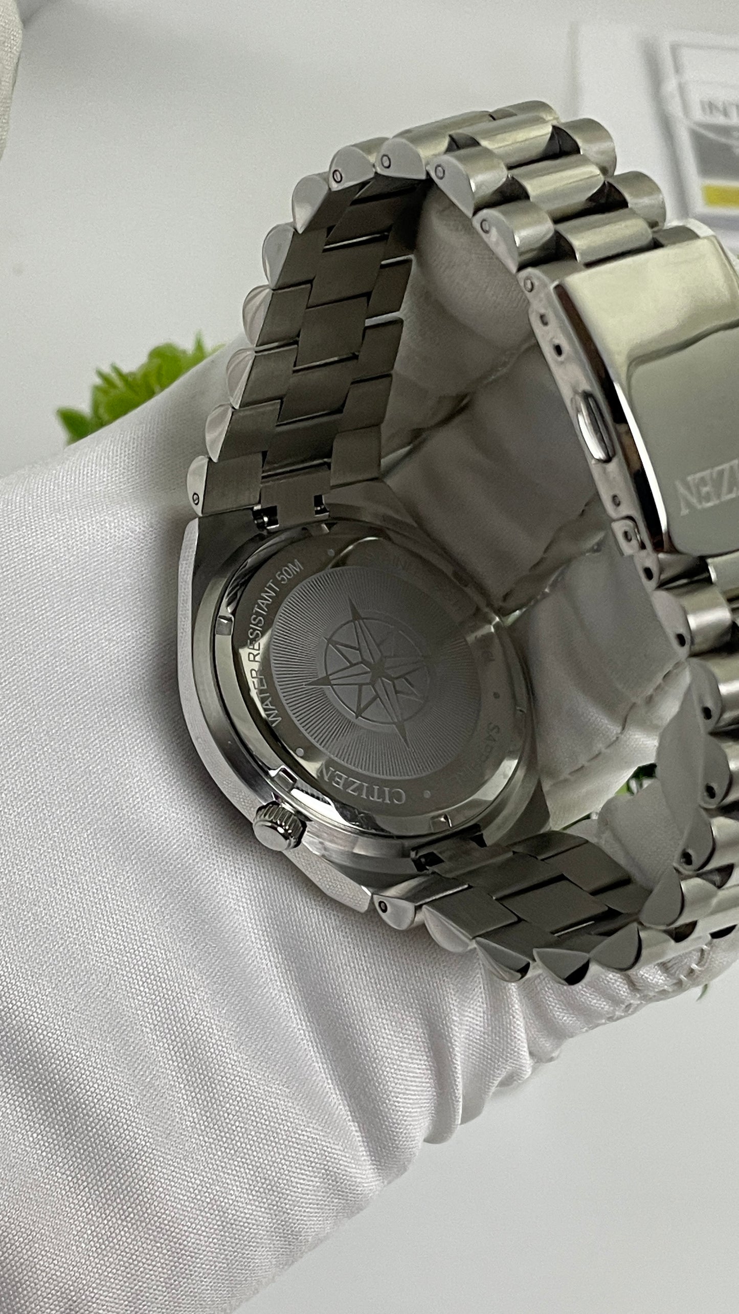Silver with Aqua Dial.