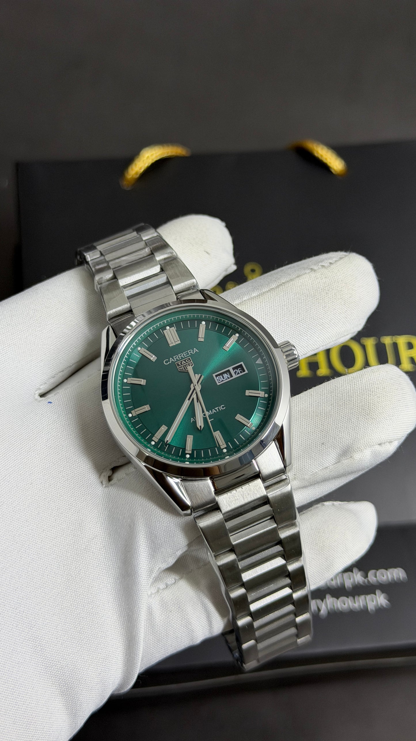 Silver with Green Dial.