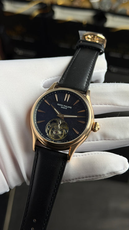 Rose Gold with Black Dial.