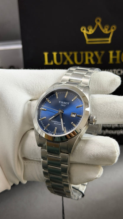 Silver with Aqua Dial.