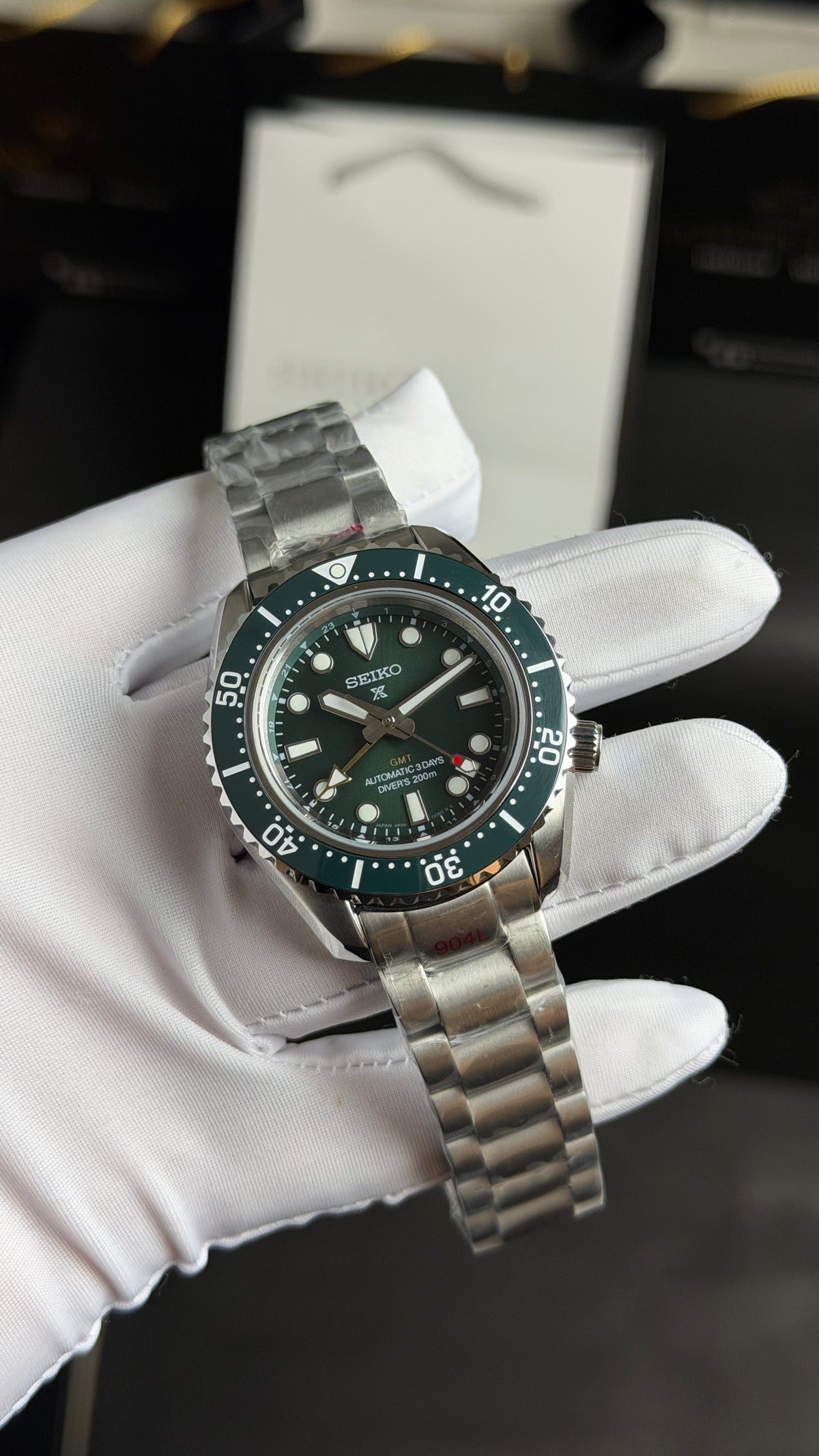 Silver with Green Dial.