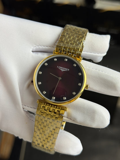 Yellow Gold with Maroon Dial.