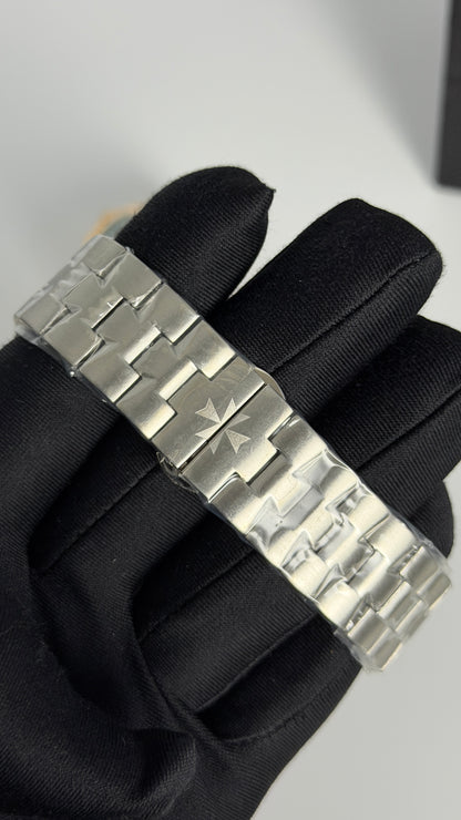 Silver with Aqua Dial.