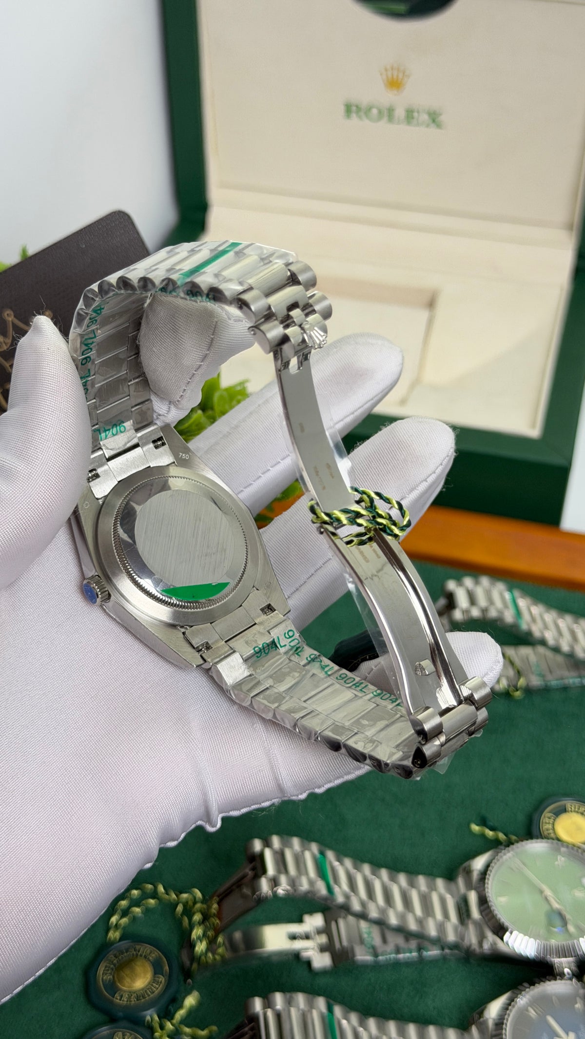 Silver with Green Dial.