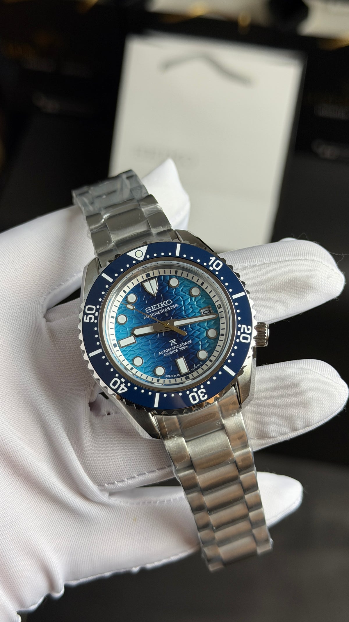 Silver with Blue Dial.