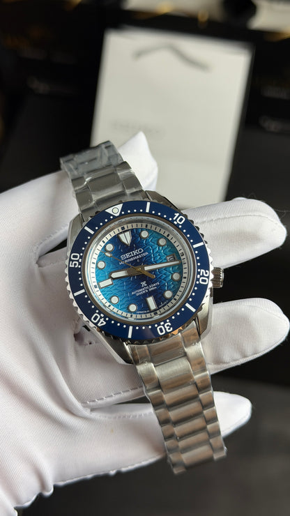 Silver with Blue Dial.
