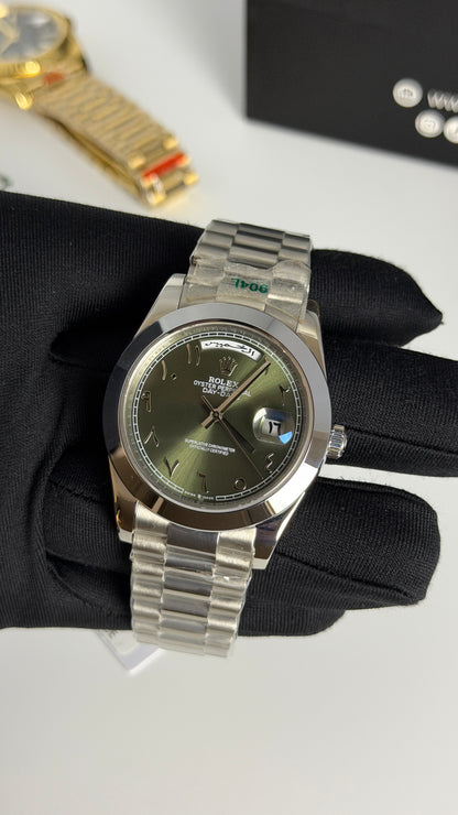 Silver with Green Dial.