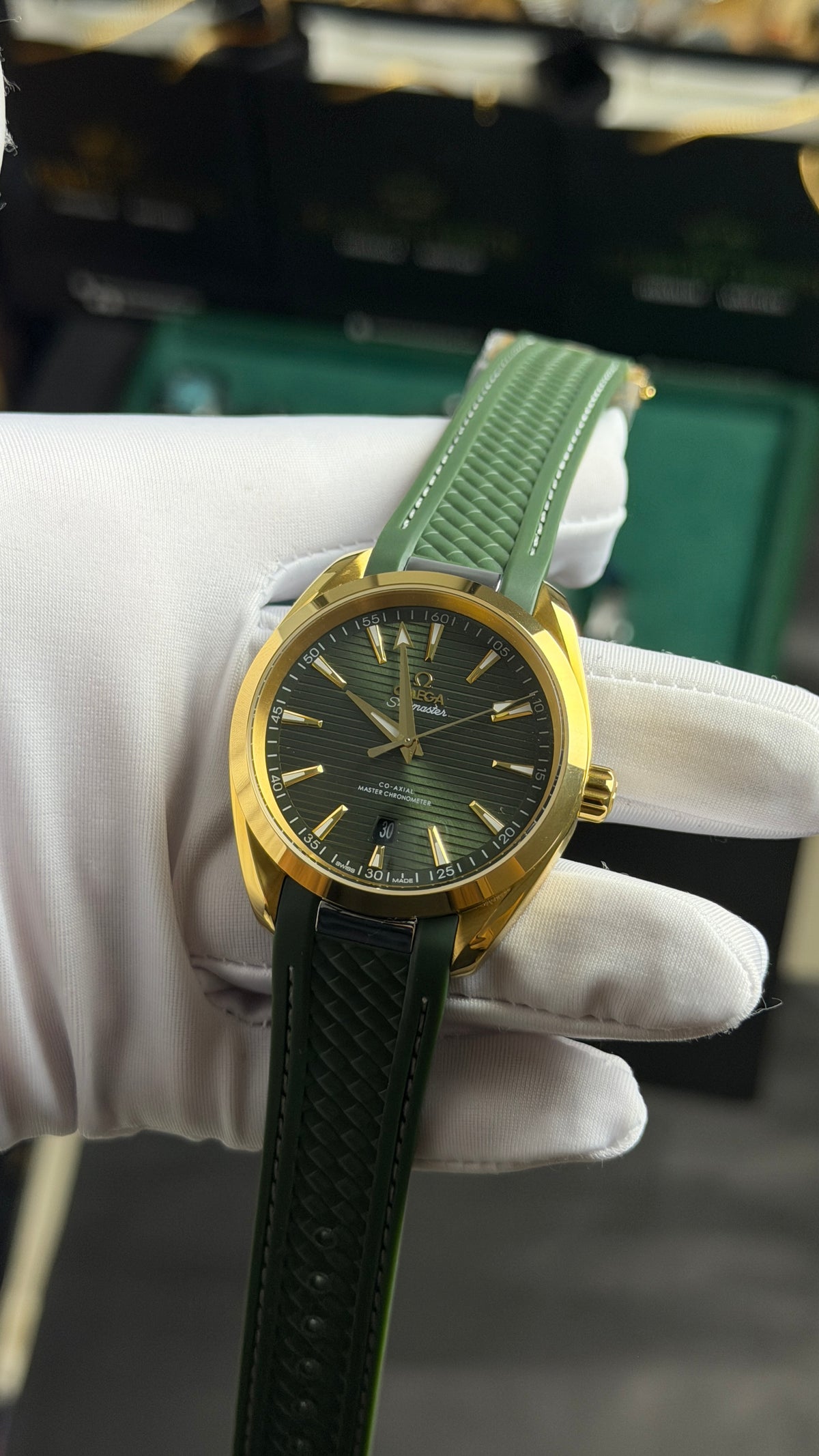 Yellow Gold with Green Dial.