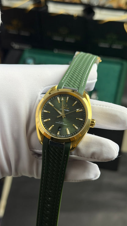 Yellow Gold with Green Dial.