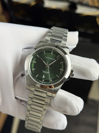 Silver with Green Dial.