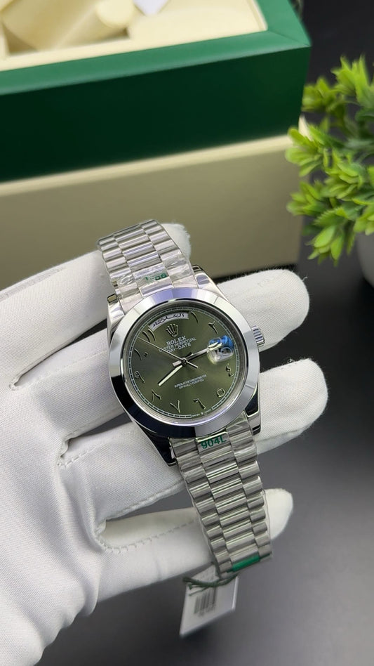 Silver with green arabic dial