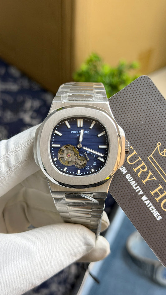 Silver with Aqua Dial.