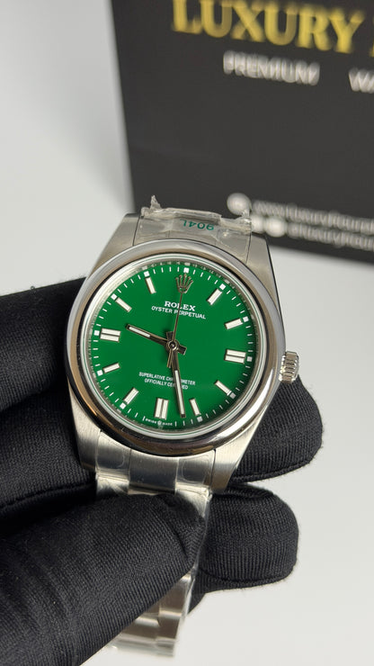 Silver with Green Dial.