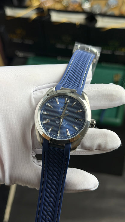 Silver with Aqua Dial.