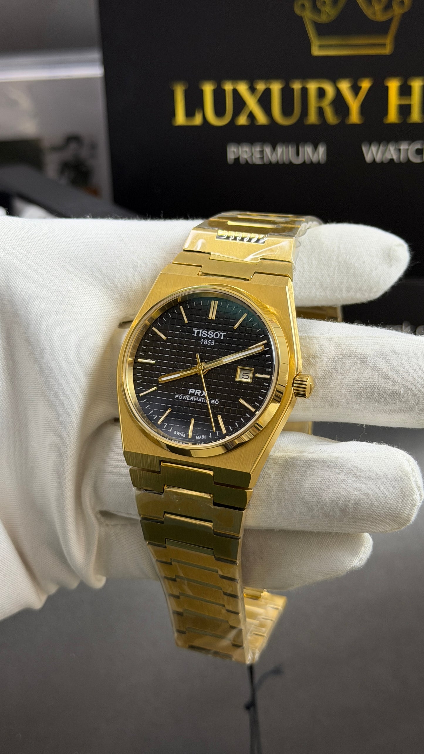 Yellow Gold with Black Dial.